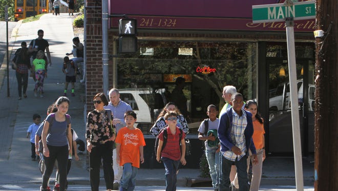 Kids cross Man Street in Mount Kisco as they walk home from school.