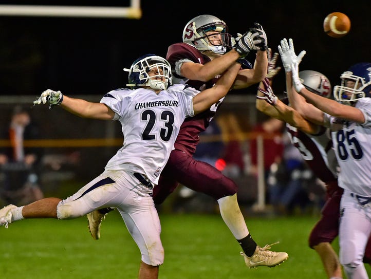 Chambersburg's Justin Reichenbach (23) breaks up a