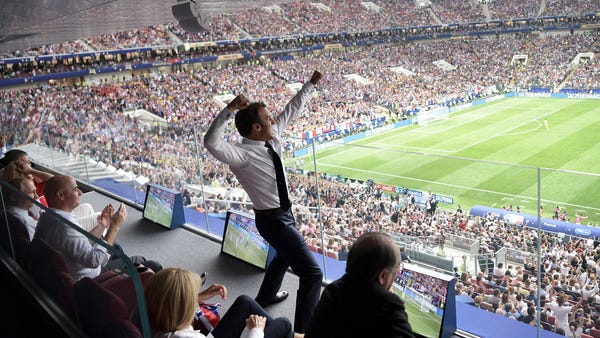 French President Emmanuel Macron reacts during the