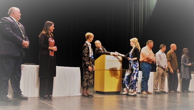 Ruidoso school district officials congratulate students being honored at Second Annual 'High 5' celebration of excellence at the Spencer Theater Wednesday, Oct. 11.
