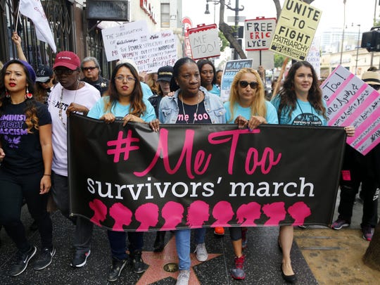Civil rights activist Tarana Burke (center), who started the #MeToo movement, marches with survivors of sexual misconduct and their supporters in Los Angeles.
