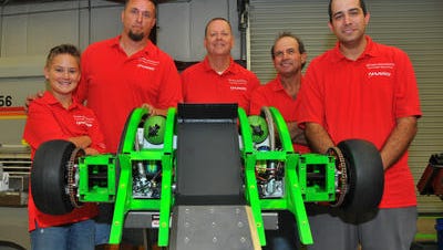 Left to right- Aidan Irvin, Sean Irvin, Don Price, Monte Keen and Jake Keen gathered around Ultimo Destructo. Carnage Robotics is a local team made up of two Harris engineers, the son of one of the engineers and a father and son machine shop owner. Their robot, Ultimo Destructo, will be competing in L.A. on the 18th-24th in Battlebots.