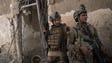 Iraqi Special Forces soldiers gather before advancing