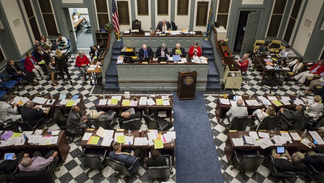House members work during the final session of the legislative season on Thursday evening.