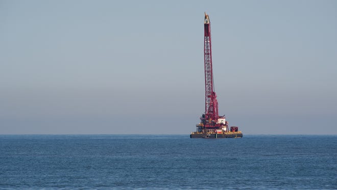Crane off the coast of Delaware for work on the Rehoboth Beach wastewater ocean outfall project.