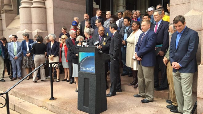 City officials and leaders of civic, social service and faith-based organizations gather Wednesday at City Hall for ID card news conference.