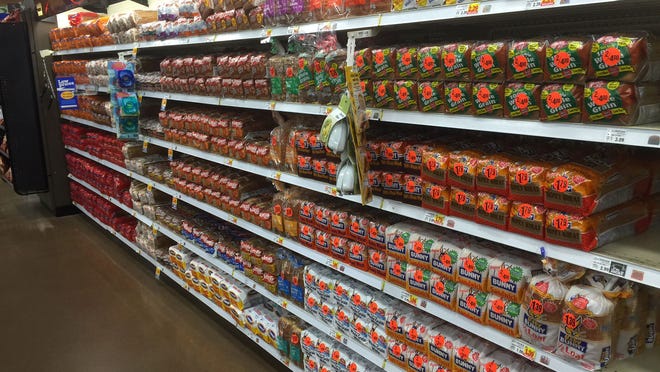 By 7 a.m., the Kroger at Poplar Plaza had already restocked the essentials -- bread and milk.