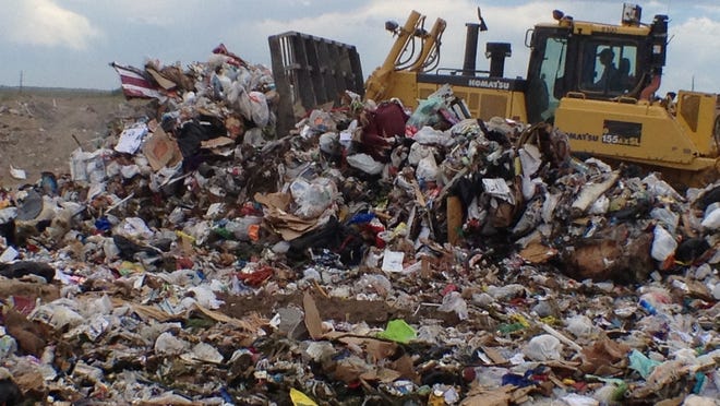 Heavy machinery is used to compact trash at the Larimer County Landfill in this 2013 file photo. Larimer County commissioners are considering how to replace the landfill once its life-cycle is up.