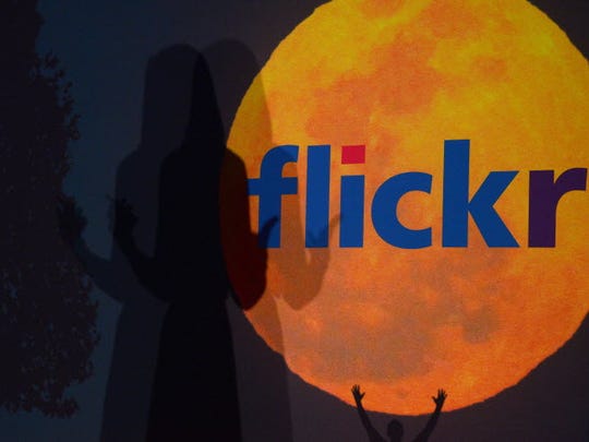 A logo for Flickr website, then owned by Yahoo, in 2013. In 2018, Smugmug said it had bought the photo sharing website for an undisclosed sum.