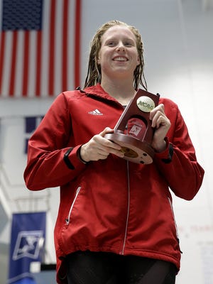 Indiana University's Lilly King holds her trophy after winning the Women's 100 Yard Backstroke at the NCAA Women's Swimming & Diving championships Friday, March 17, 2017, at the Natatorium at IUPUI in Indianapolis.