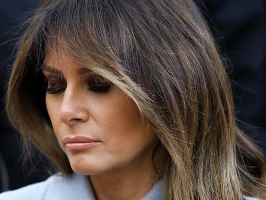 First lady Melania Trump has a pensive look while sitting