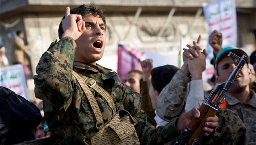A Houthi Shi'ite fighter  chants slogans during a demonstration to show support for his comrades in Sanaa, Yemen, on Friday, Jan. 23, 2015. Thousands of protesters have been demonstrating across Yemen, some supporting the Shi'ite rebels who seized the capital and others demanding the country's south secede after the nation's president and cabinet resigned.