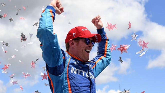 Scott Dixon celebrates his victory in the Kohler Grand Prix in victory lane on Sunday at Road America in Elkhart Lake.