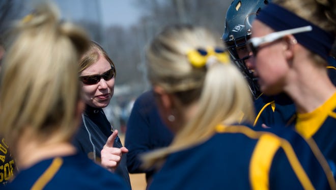 Augustana women's softball head coach Gretta Melsted chats with the team after a win against Northern State March 29, 2013.