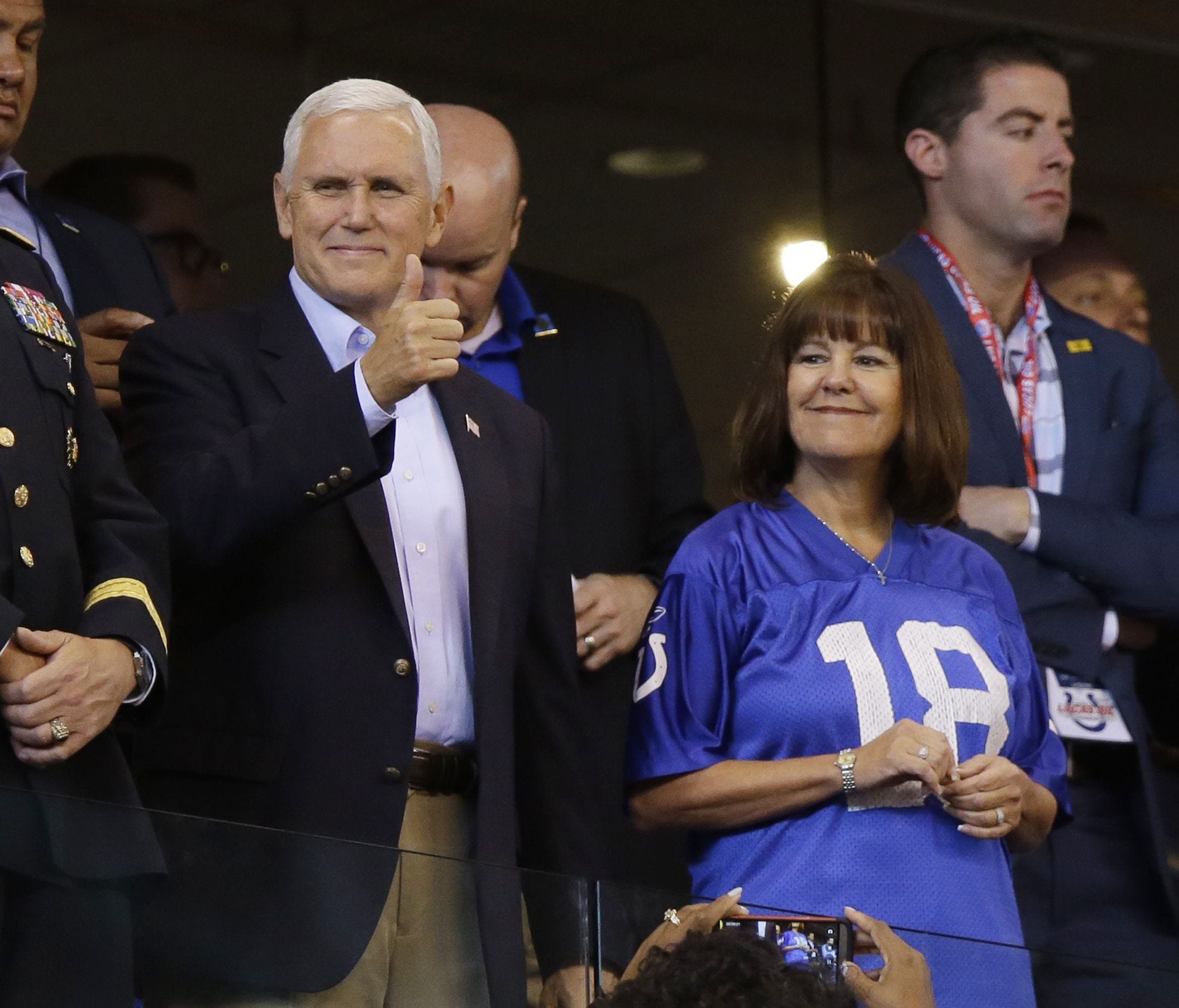 Vice President Mike Pence reacts to fans before an NFL game between the Indianapolis Colts and the San Francisco 49ers before he left the game Oct. 8 in Indianapolis.