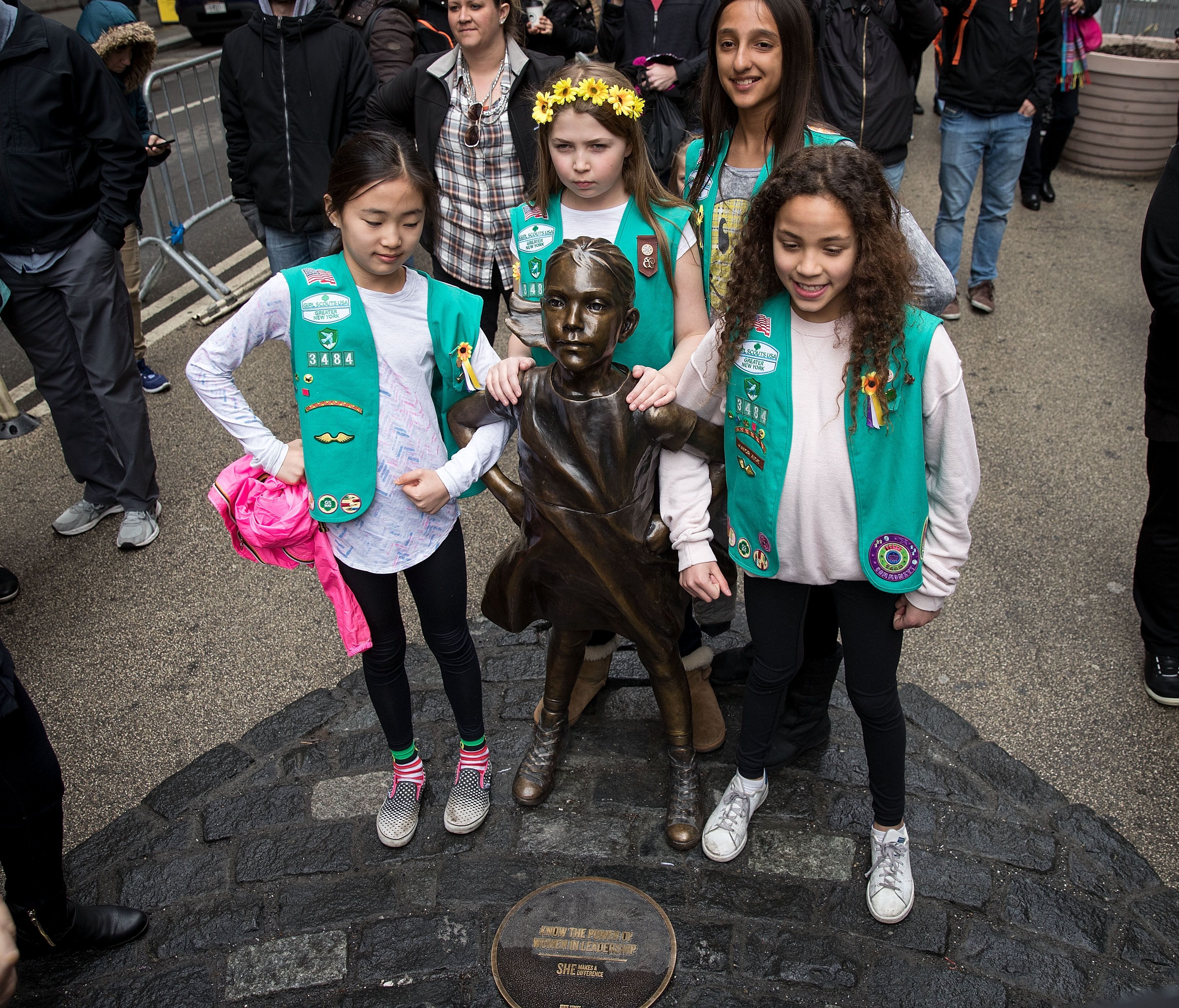 Members of Girl Scout Troop 3484 pose for photos with the 