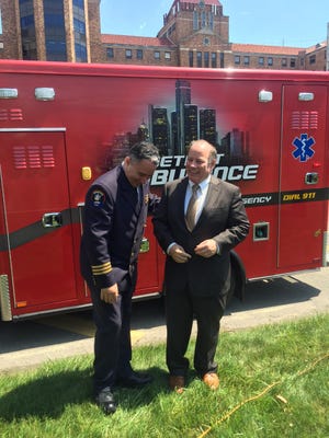 Detroit EMS Chief Sean Larkin and Mayor Mike Duggan come together Wednesday to announce 4 percent raises for EMTs and paramedics.