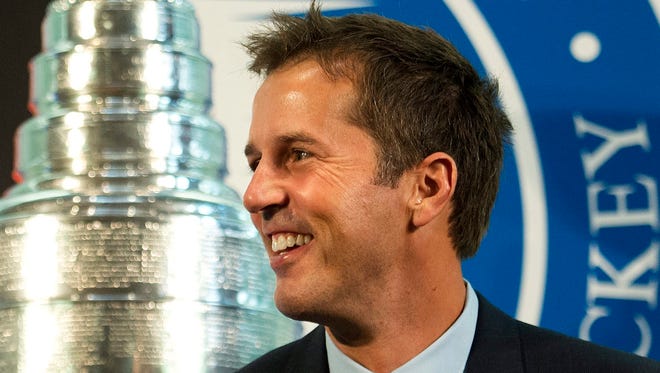 Hockey Hall of Fame 2014 inductee Mike Modano smiles during a news conference in Toronto, Friday, Nov. 14, 2014.