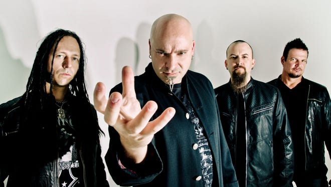 The memers of Disturbed — from left, John Moyer, David Draiman, Mike Wengren and Dan Donegan — released 'Immortalized,' their first album in five years, Aug. 21.