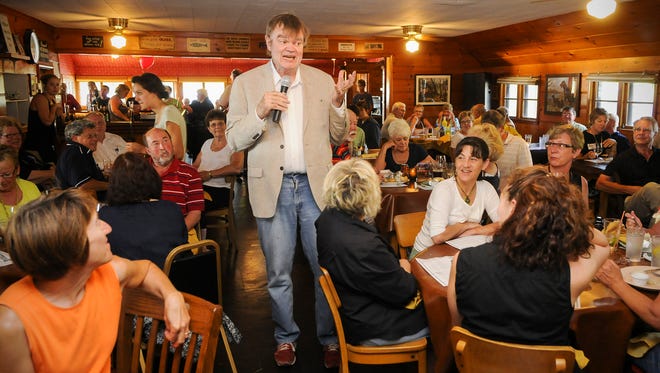 Garrison Keillor serenades dinner guests at Fisher's Club in Avon to celebrate his birthday in 2011.