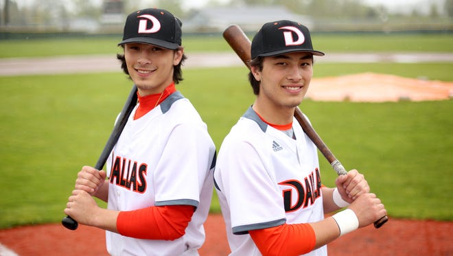 Tanner Earhart, left, a senior outfielder, and his brother Treve Earhart, a junior catcher, at Dallas High School in Dallas, Ore., on Monday, April 17, 2017.