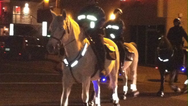 Mounted Scottsdale police officers patrol downtown entertainment district. December 2013