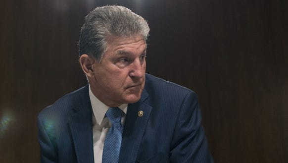 Sen. Joe Manchin, D-W.Va., looks on before the arrival