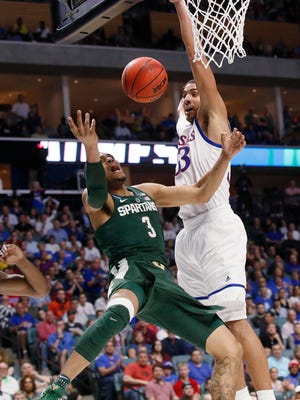 Michigan State guard Alvin Ellis III (3) shoots in front of Kansas forward Landen Lucas (33) during the second half of a second-round game in the NCAA men's college basketball tournament in Tulsa, Okla., Sunday, March 19, 2017. Kansas won 90-70.