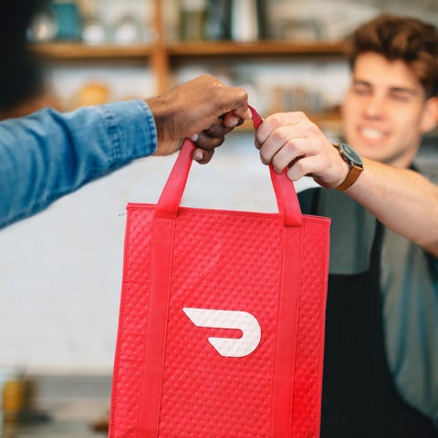 A DoorDash Dasher accepts a delivery.