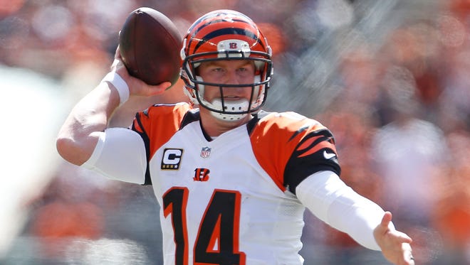 Cincinnati Bengals quarterback Andy Dalton (14) throws against the Atlanta Falcons during the first quarter of their game played at Paul Brown Stadium in Cincinnati, Ohio Sunday September 14, 2014. The Enquirer/Gary Landers