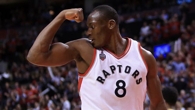 Bismack Biyombo of the Toronto Raptors celebrates a dunk late in the second half of Game 5 of the Eastern Conference quarterfinals against the Indiana Pacers during the 2016 NBA Playoffs at the Air Canada Centre on April 26, 2016 in Toronto, Ontario, Canada.