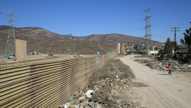A border wall prototype is seen near the Otay Mesa Port of Entry outside of San Diego on October 16, 2017. U.S. Customs and Border Protection have begun a series of tests using jackhammers, saws and ropes, to see how well prototypes of a potential U.S.-Mexico border wall withstand potential assaults.