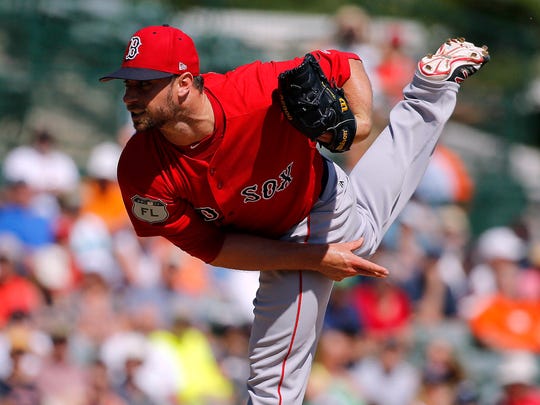 Tyler Thornburg of the Red Sox throws a shot against