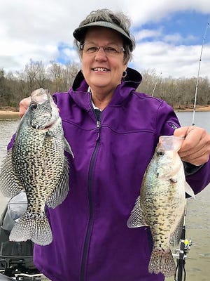 Linda Arnold of Memphis holds two slab crappie she caught recently on Kentucky Lake fishing with guide Doug Wynn.