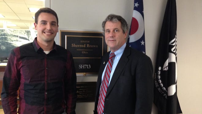 West Clermont teacher Jason Jacobs, left, was invited to attend Tuesday’s State of the Union address by Sen. Sherrod Brown, an Ohio Democrat. Brown is seeking to expand the earned income tax credit to help low-income workers like Jacobs.