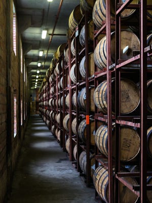 Rows of bourbon barrels age inside a Brown-Forman warehouse off Dixie Highway.