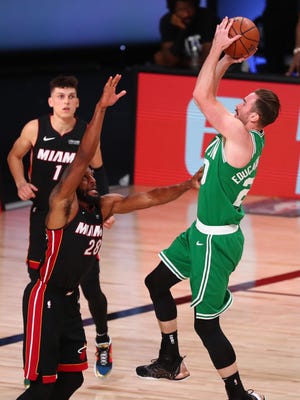 Celtics forward Gordon Hayward shoots over the Heat's Andre Iguodala (28) as Tyler Herro watches during Game 3 of the Eastern Conference finals on Saturday. The three-day break between games has helped Hayward, who is just back from an ankle injury.