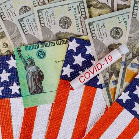 $100 bills, a stimulus check from the U.S. Treasur