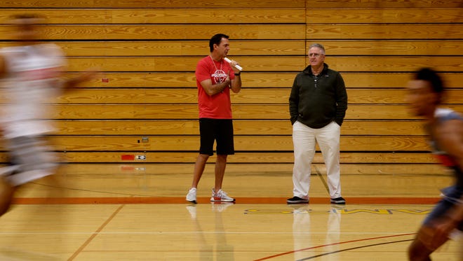 Simpson mens basketball coach Todd Franklin, center, and assistant coach Mike Haworth watch the team scrimmage Monday at the college in Redding.