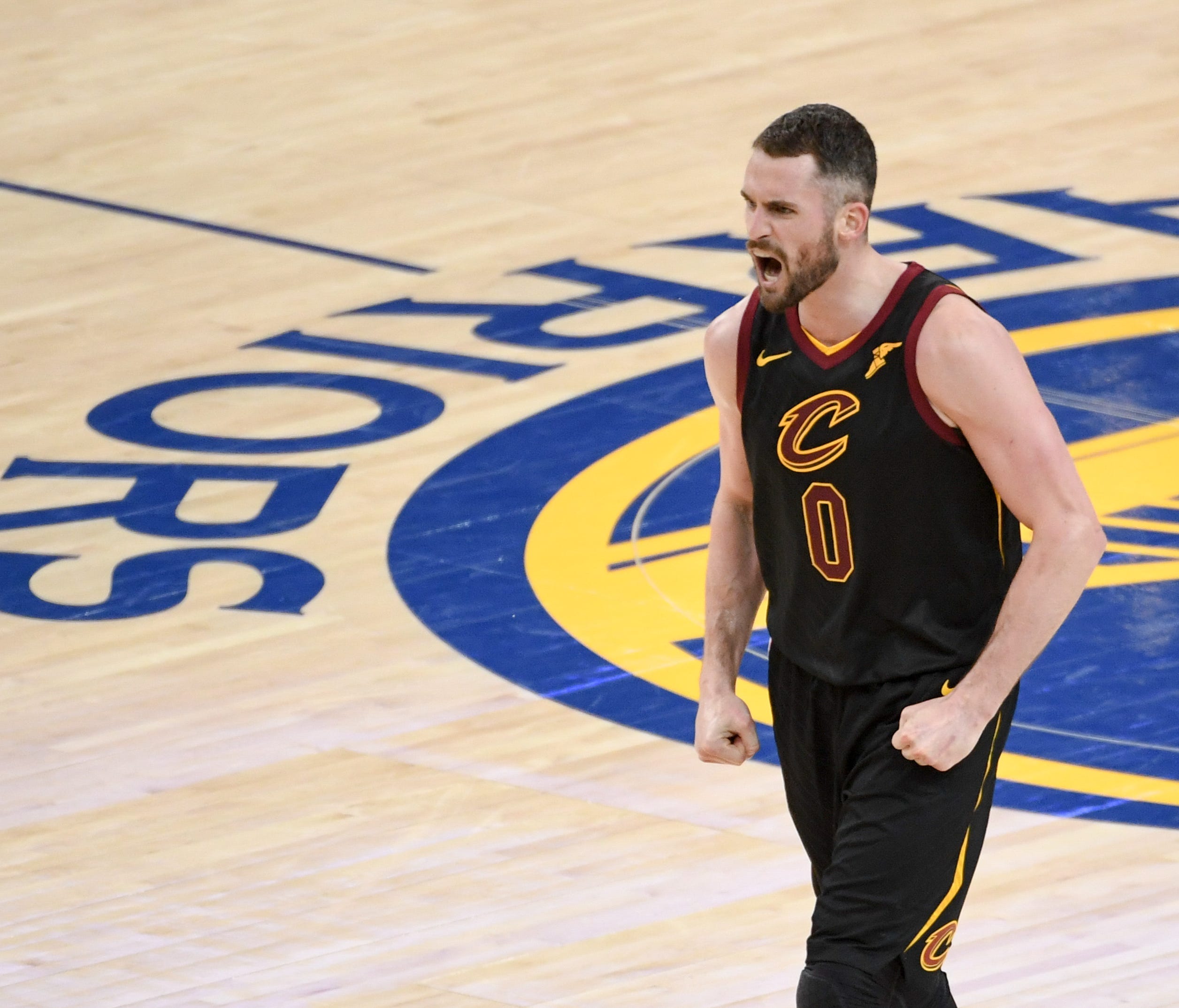 Cleveland Cavaliers center Kevin Love celebrates during the fourth quarter in Game 1 of the 2018 NBA Finals.