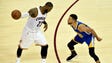 LeBron James handles the ball against Stephen Curry
