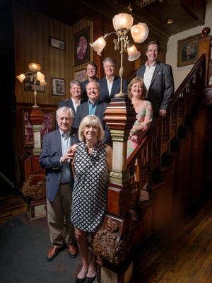 The Mitchell family, owners of Seville Quarter, pose on the stairs inside Rosie O'Grady's in Pensacola on Monday, August 7, 2017.  Seville Quarter is celebrating its 50th Anniversary.