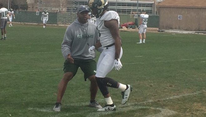 Terry Fair, CSU's cornerbacks coach, works with senior A'Keitheon Whitner on his technique during Saturday's practice. The Rams are down to five healthy cornerbacks for spring practice after losing senior Shun Johnson to a shoulder injury Saturday.