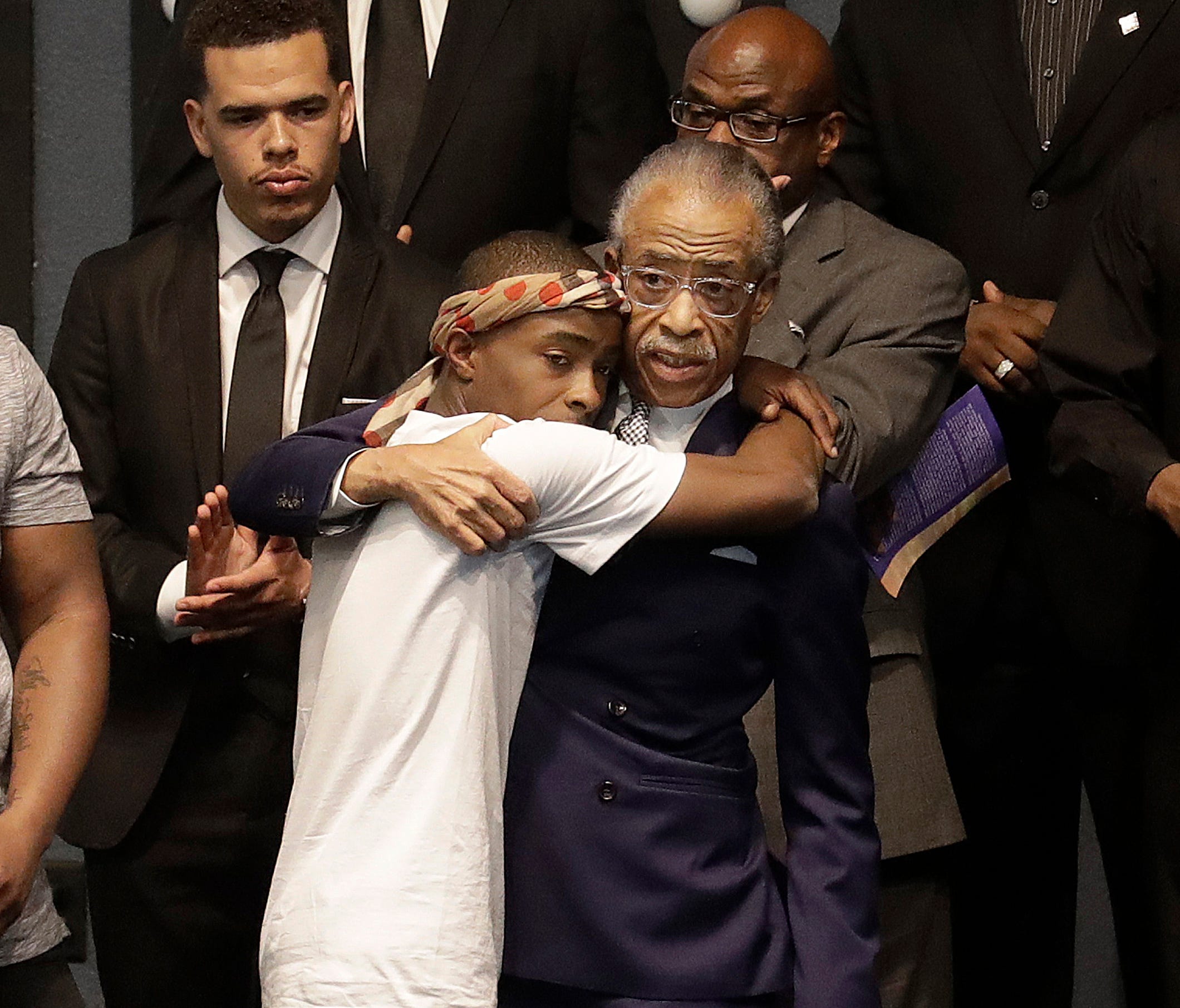 Rev. Al Sharpton (right) hugs Stevante Clark during the funeral services for police shooting victim Stephon Clark at Bayside Of South Sacramento Church in Sacramento, Calif.