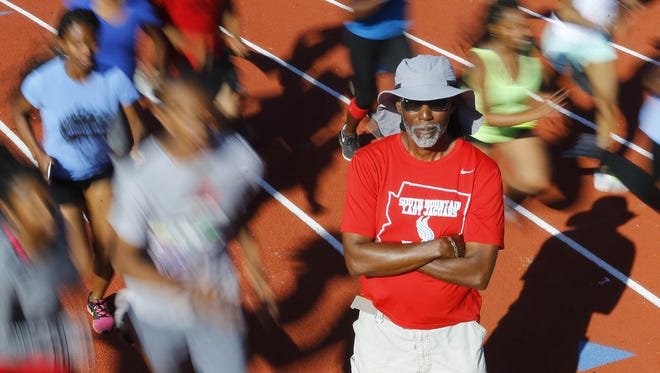 South Mountain track coach Dwayne Evans Tuesday, Mar. 21, 2017 in Phoenix, Ariz. Evans set a state record in the 200 in 1976 that still stands. He won an Olympic bronze medal that year right out of high school.