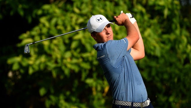 Jordan Spieth hits a shot during the first round of the Singapore Open at the Sentosa Golf Club in Singapore.