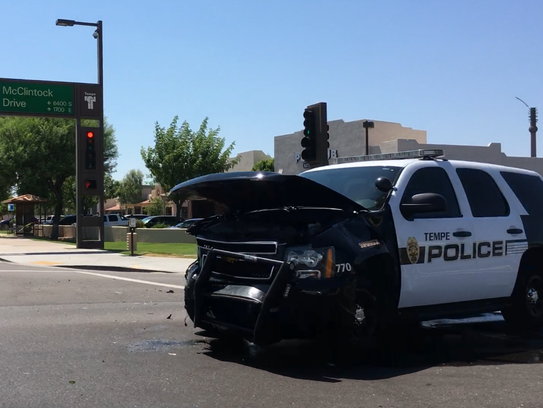 A Tempe police officer responding to a call with lights