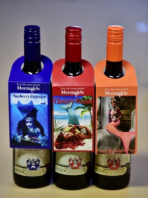 Most wines come with specialty hangers featuring drink recipes and local models. 