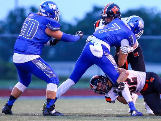 Northville's Ryan Nelson (bottom) tries to grab the