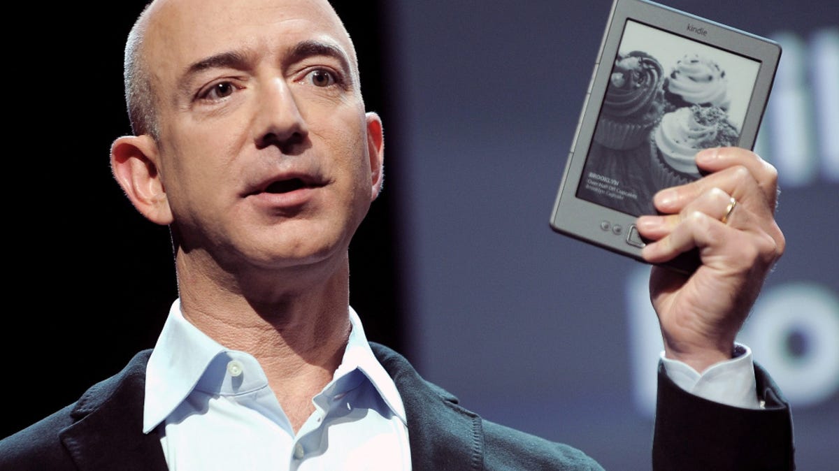 Jeff Bezos, CEO of Amazon.com, holding a  Kindle